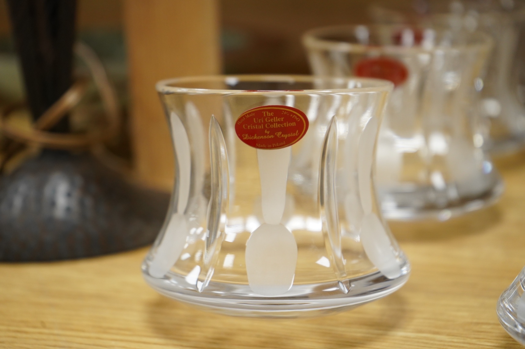 A collection of twenty five Uri Geller Crystal Collection whisky tumblers by Dickenson Crystal, 9cm high